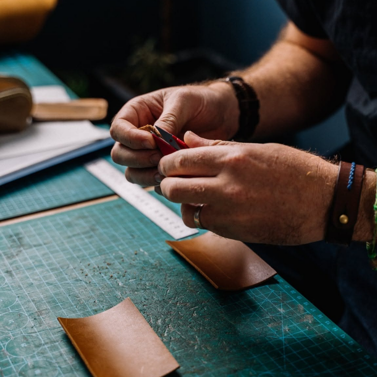 Artisan making custom leather hotel amenities
