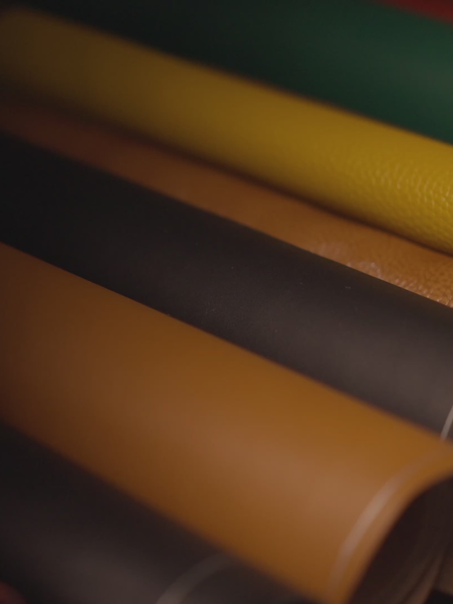 Artisan hand-stitching leather at the Gallery de Neyuh workshop in Saigon